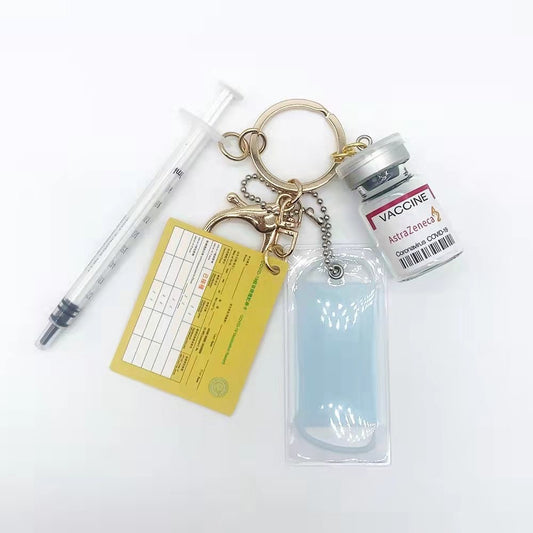 Medicine bottle mask keychain